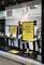 A shop window with two male mannequins wearing stylish clothing. A yellow sign reading 'Style Advisory's Choice'.