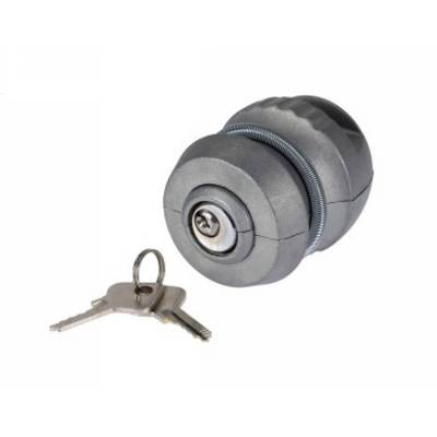 A grey bicycle lock with a key, cylindrically shaped, lies on a white surface.