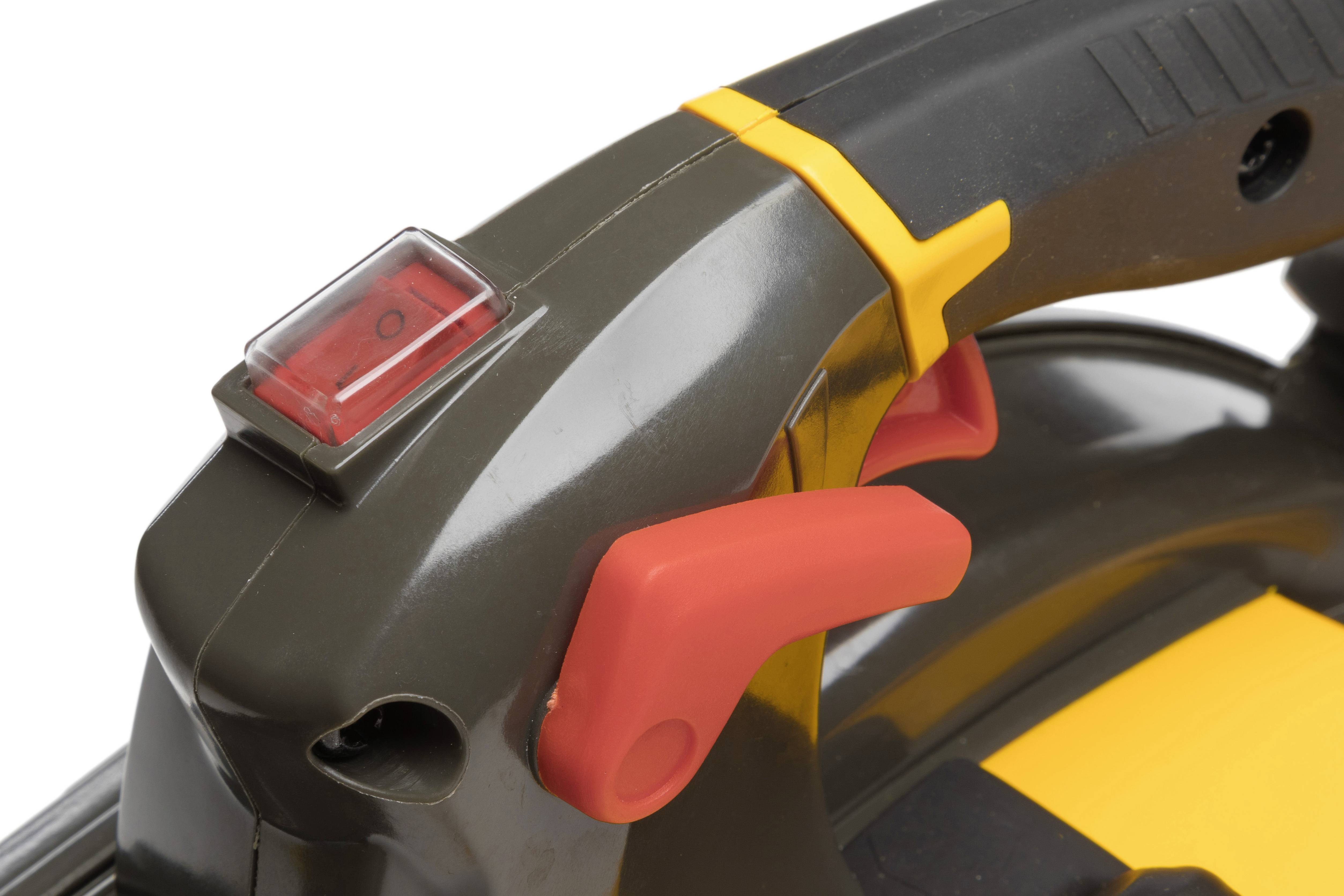 Close-up of an electric power tool switch with a red on/off switch and a yellow trigger lock.