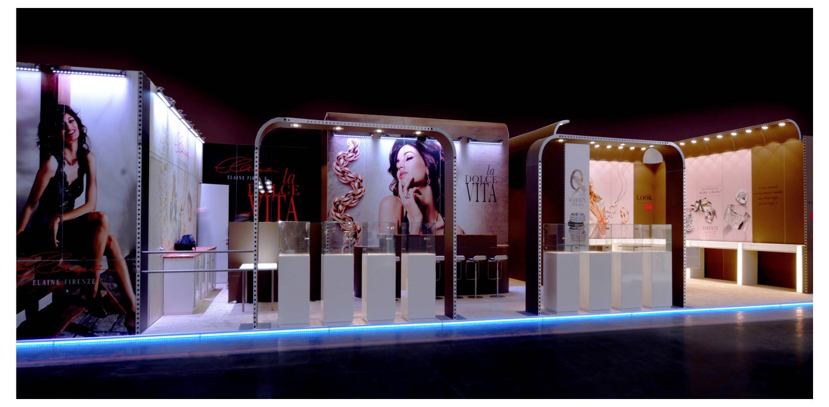 Illuminated retail display booths showcase lingerie and beauty advertising posters in a dark exhibition space.