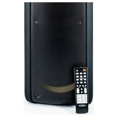 Black portable speaker with a remote control leaning against it on a white background.