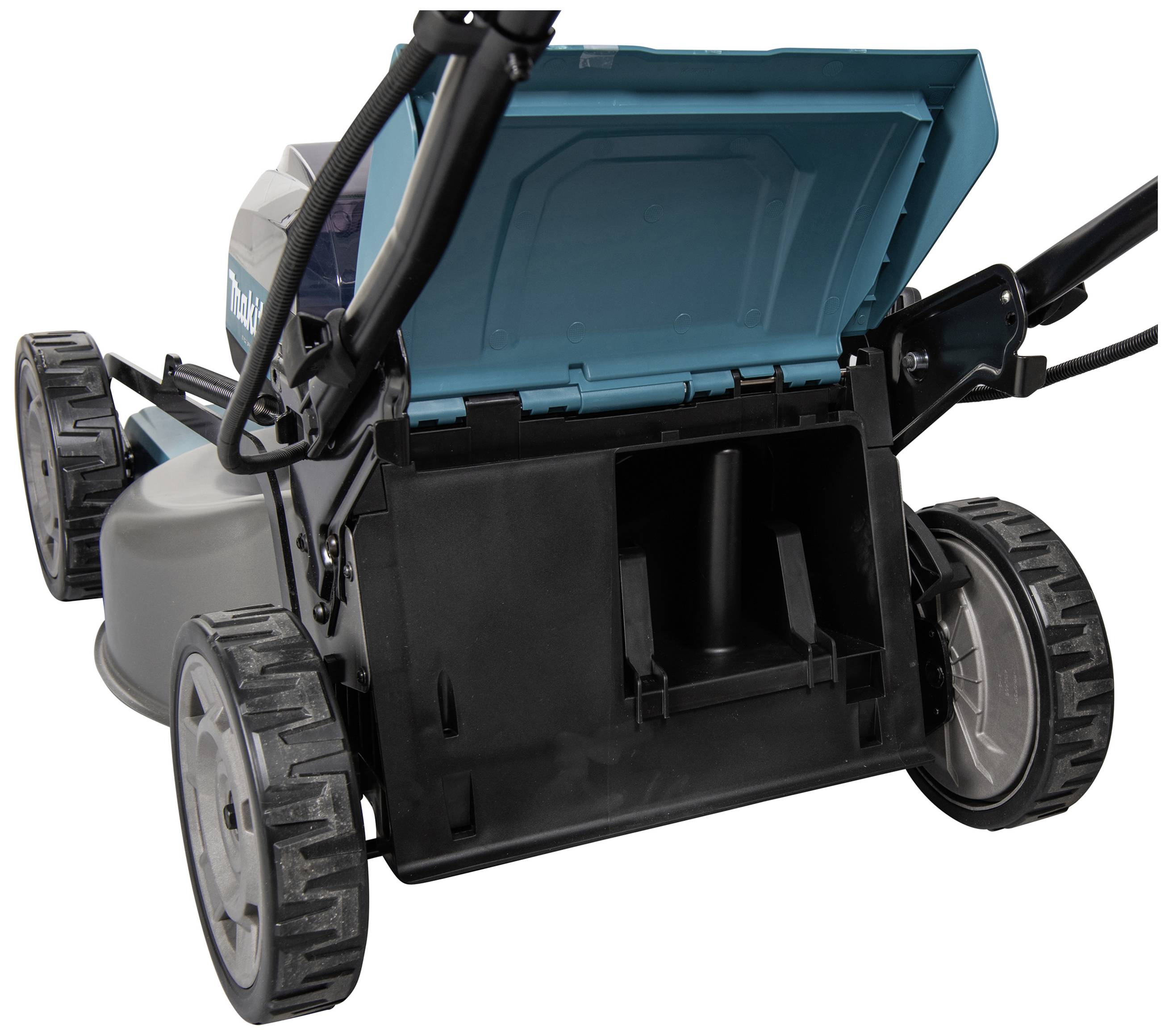 A lawnmower with an open grass collector. The view shows the interior of the collector and the rear wheels of the mower.