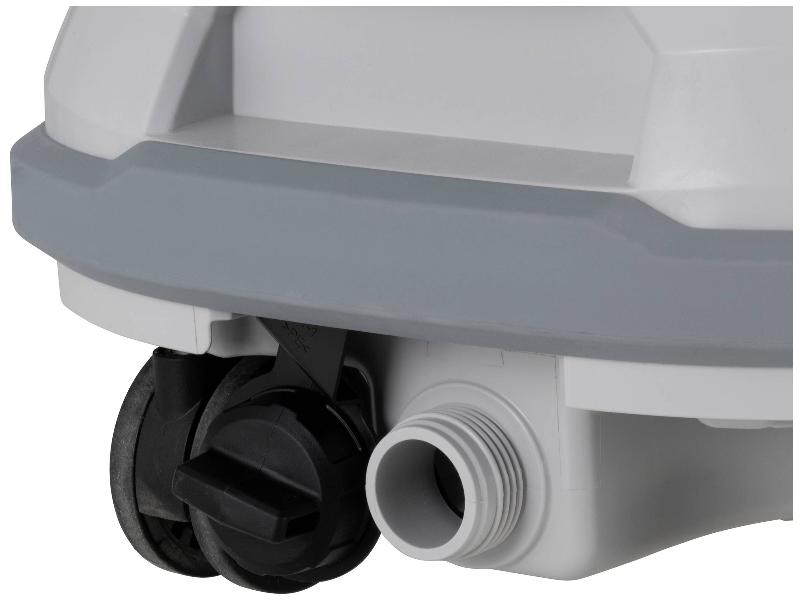 A grey plastic connector on a device, likely for water pipes. To the right, another black component.