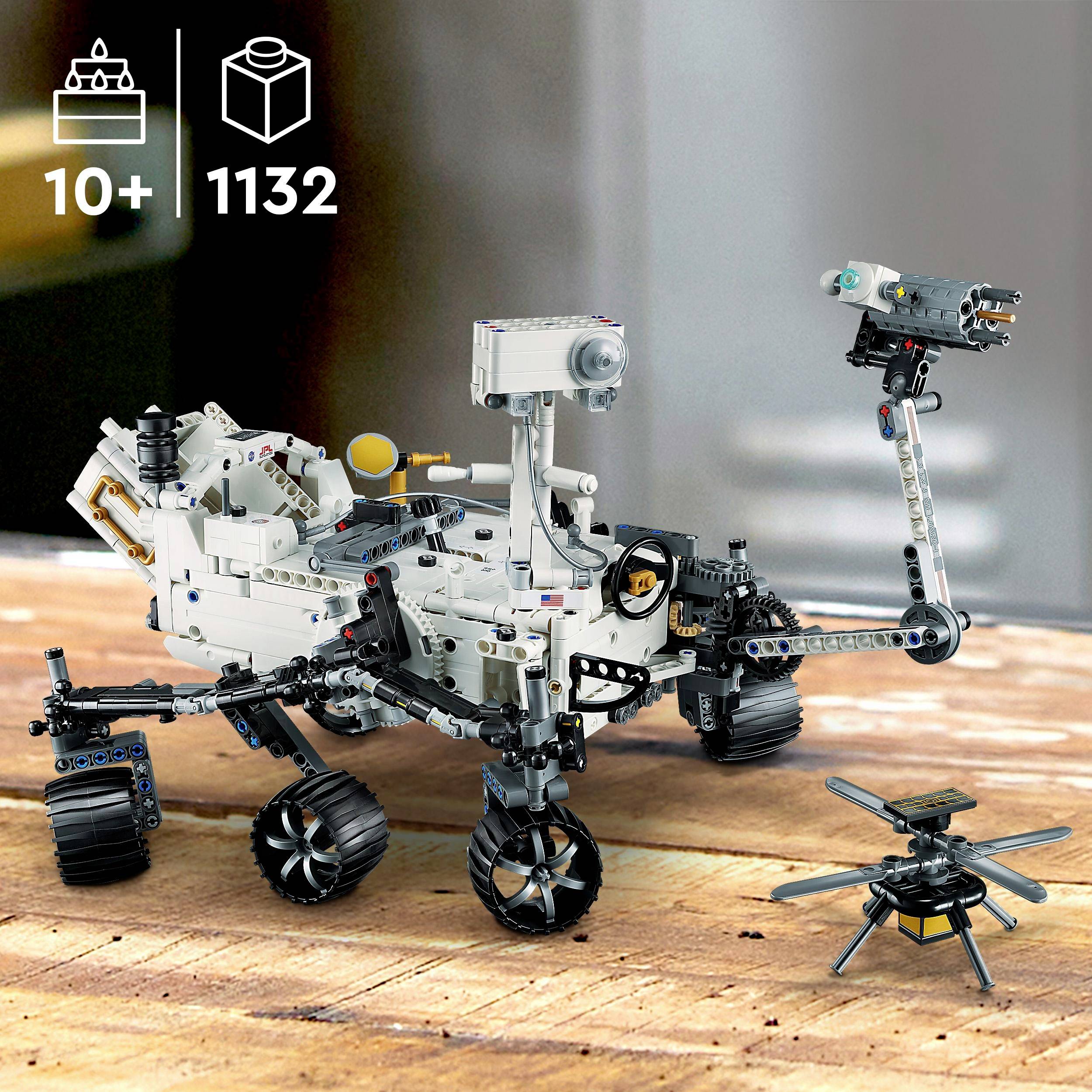 A model kit of a Mars rover with 1,132 pieces for children aged 10 and above, showing the rover on a wooden surface with a small helicopter.