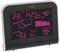 Electronic weather station displays indoor and outdoor temperature, time, weather forecast with symbols, air pressure trend, and humidity.