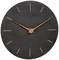 A minimalist, round wall clock with a dark grey dial and simple, wood-coloured hands. Markings are thin lines.