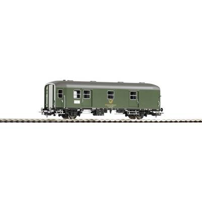 A green model railway goods wagon with four wheels on a section of track. The wagon bears the logo of the Deutsche Bundespost.