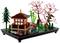 LEGO set depicts a Japanese garden with a pavilion, a red bridge, cherry blossom trees, and a pond on a black base.
