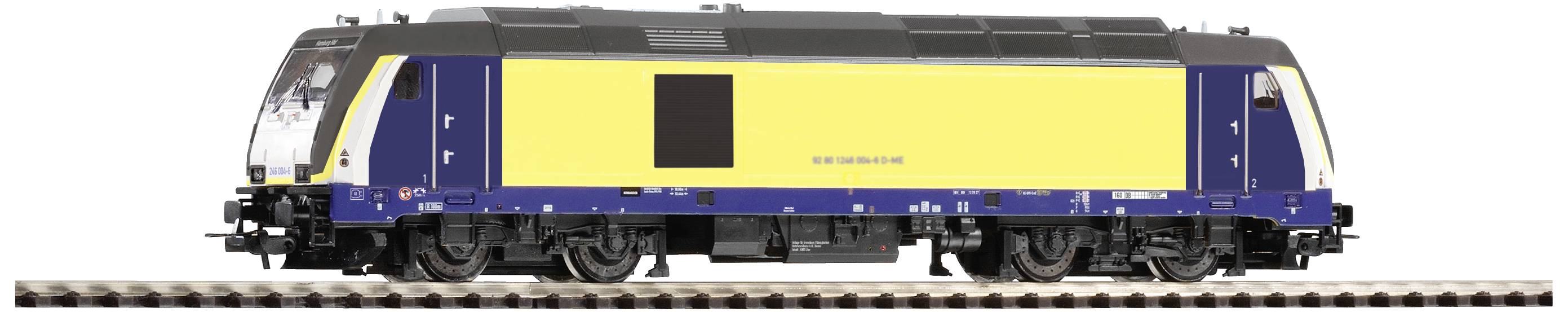 Yellow and blue model locomotive on a rail track, side view.
