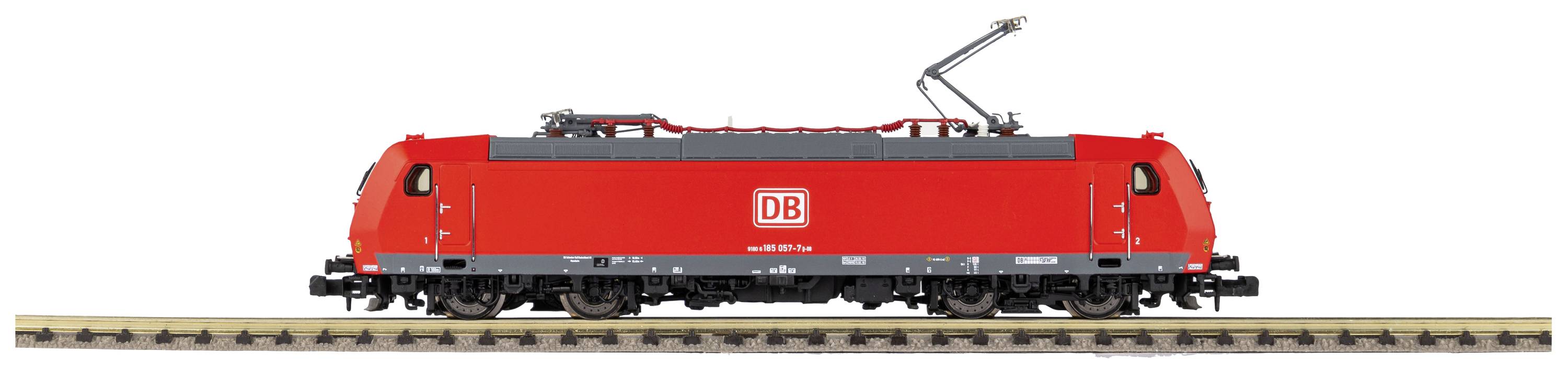 Red model of a Deutsche Bahn train on railway tracks, side view with distinctive emblem.
