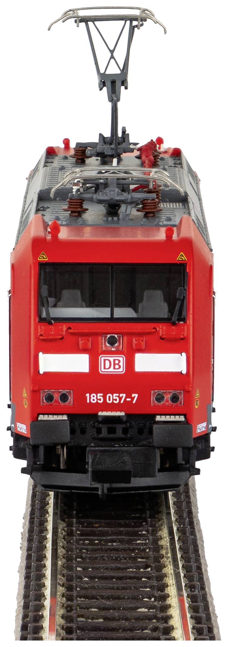 Red electric locomotive of Deutsche Bahn positioned frontally on a track, with pantograph raised and label 'DB 185 057-7'.