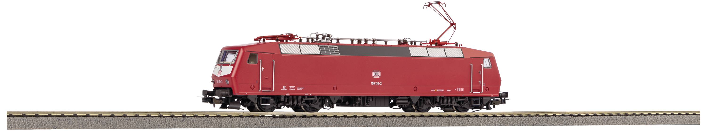Red locomotive on a track, side view. Nothing is visible in the background.