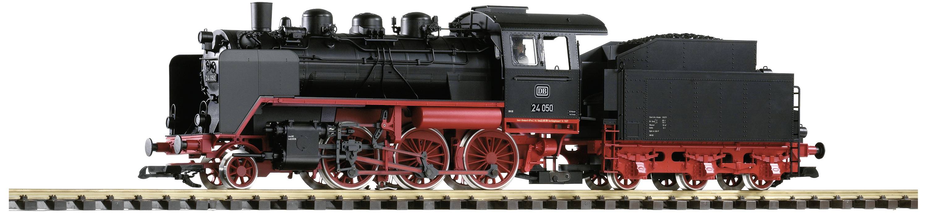 Black steam locomotive with red details on rails, side view. Elegant, classic design, emphasising engineering craftsmanship.
