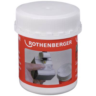 Container with the label 'Rothenberger', showing a hand holding a metallic tool, next to an open tin.