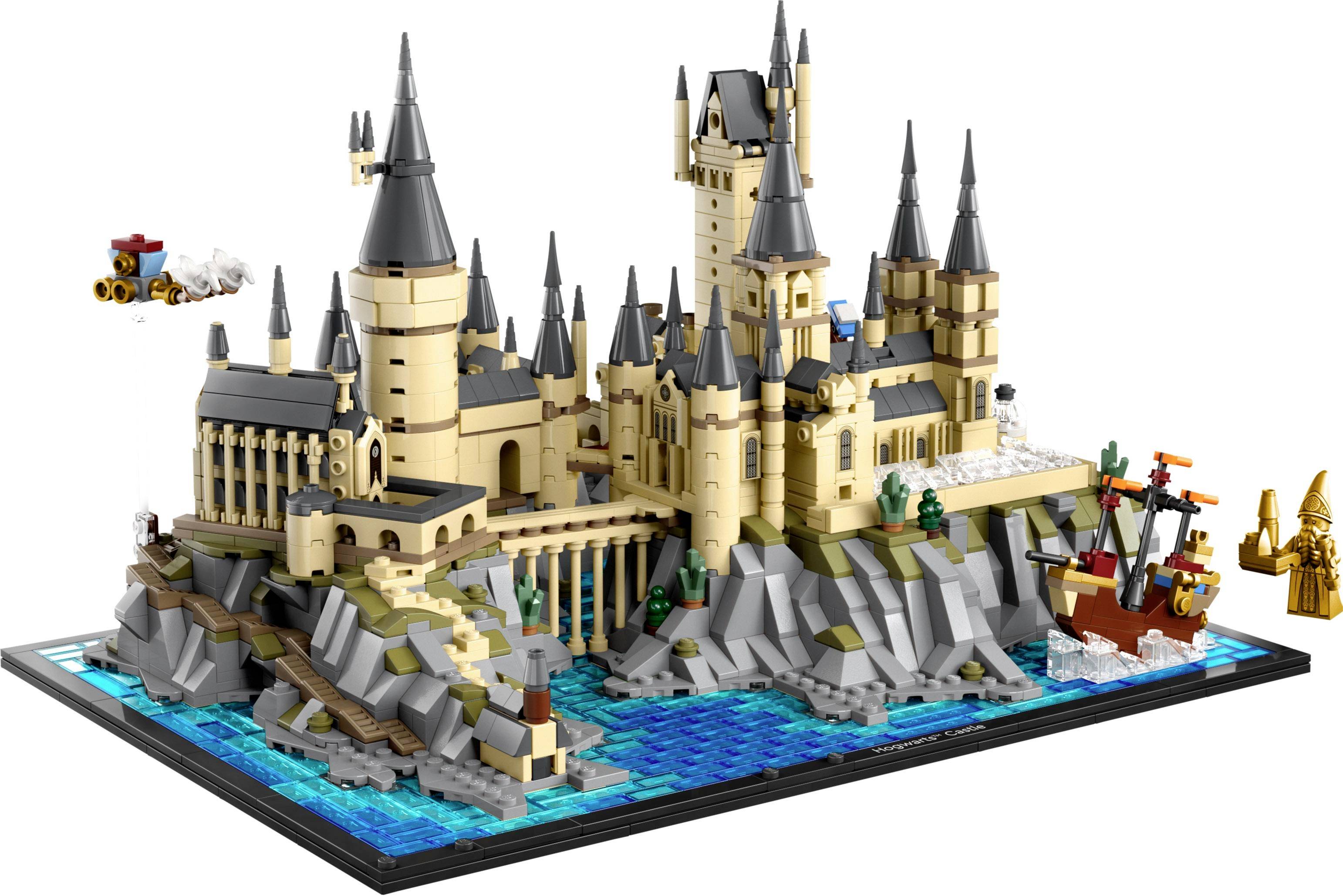 A detailed model of a castle made from building blocks, surrounded by rocky cliffs and water, with a flying train and a ship.