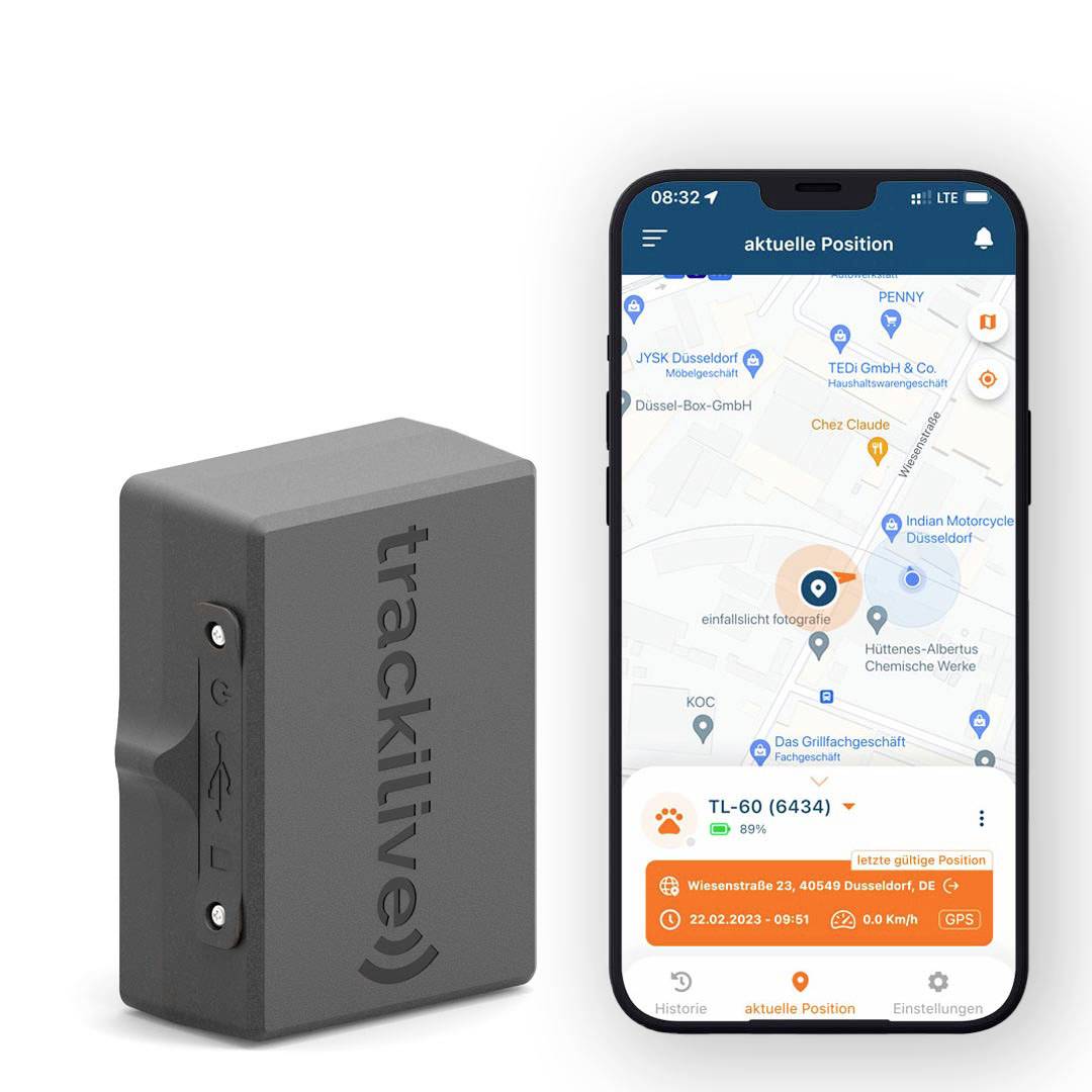 A GPS tracker beside a smartphone, displaying an app showing the tracker's current location, route, and speed.