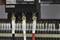 'Three cables, labelled L1, N and L2, are attached to an electrical connection. Blurred cables can be seen in the background.'
