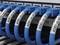 Close-up of blue Ethernet cables plugged into numbered ports of a network switch. Each cable is labelled.