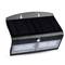A black solar light with two LED illumination surfaces and a motion sensor, suitable for wall mounting in outdoor areas.