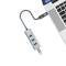 A USB hub with three blue USB ports is connected to a laptop.