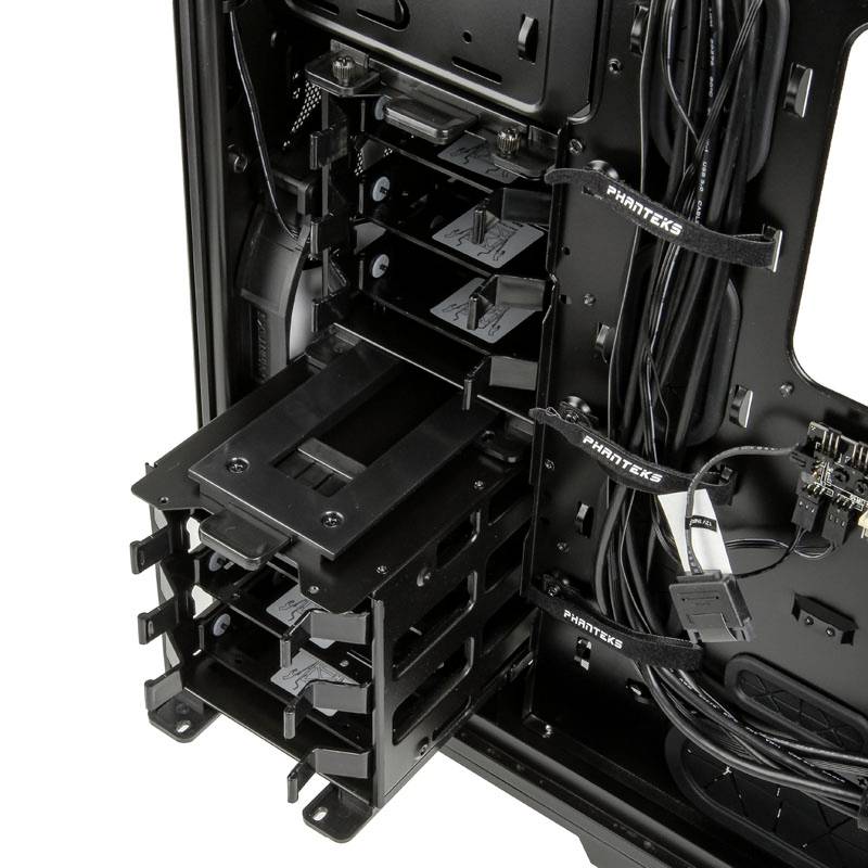 The figure shows the interior of a computer case with hard drive bays and cables, ready for hardware installation.