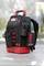 A black tool rucksack with red accents and multiple compartments, standing on a table. The 'Wiha' brand is visible.