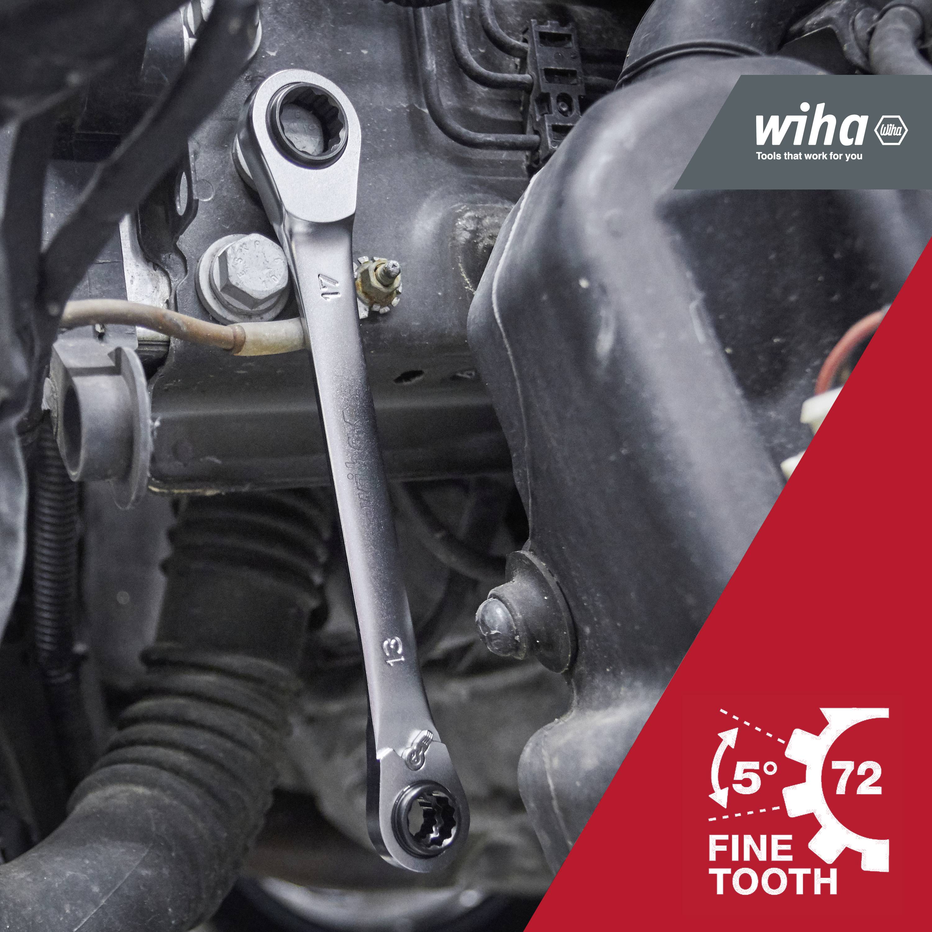 A ring spanner in a tight engine compartment; 'Wiha' logo and 'Fine Tooth 72' text indicates precision tool.