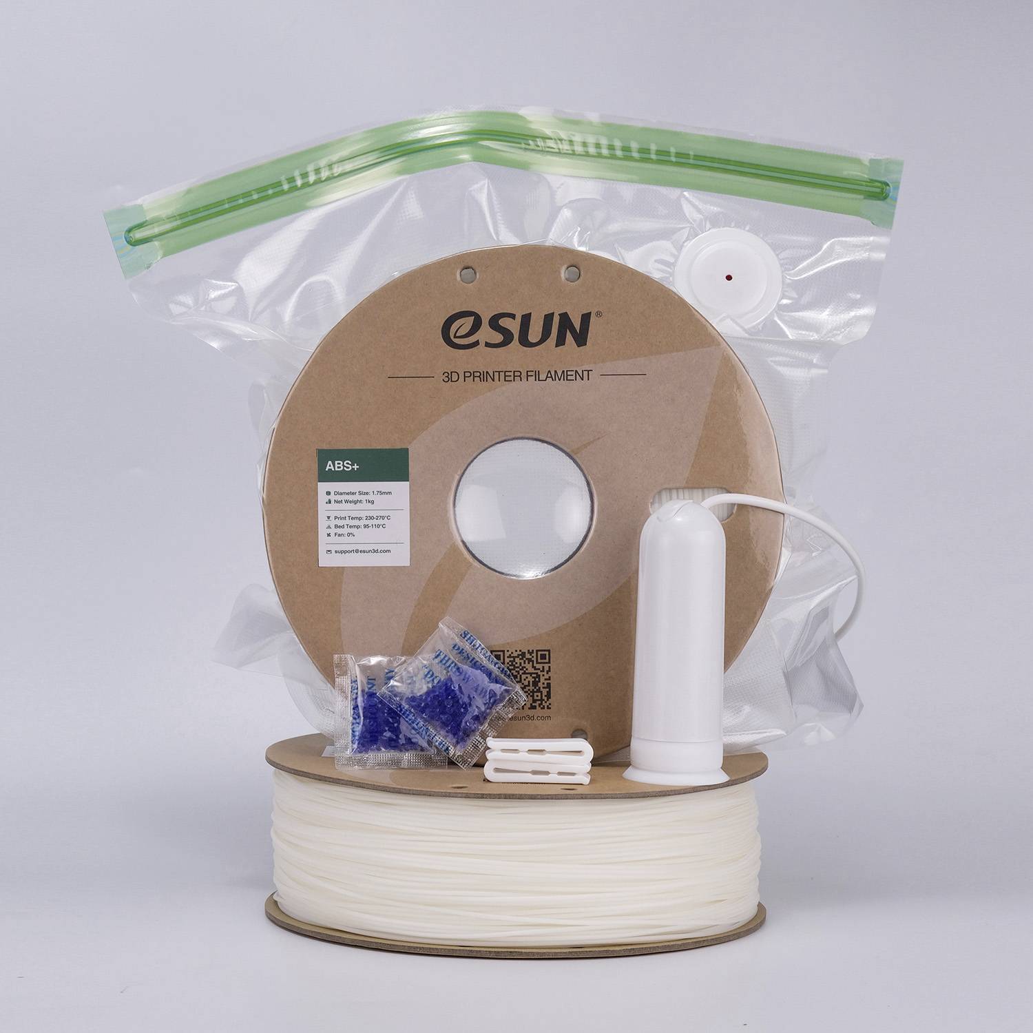 eSUN 3D Printer Filament Reel. Made from ABS+ Material, in a transparent package, with accessories. Ideal for precise 3D printing.