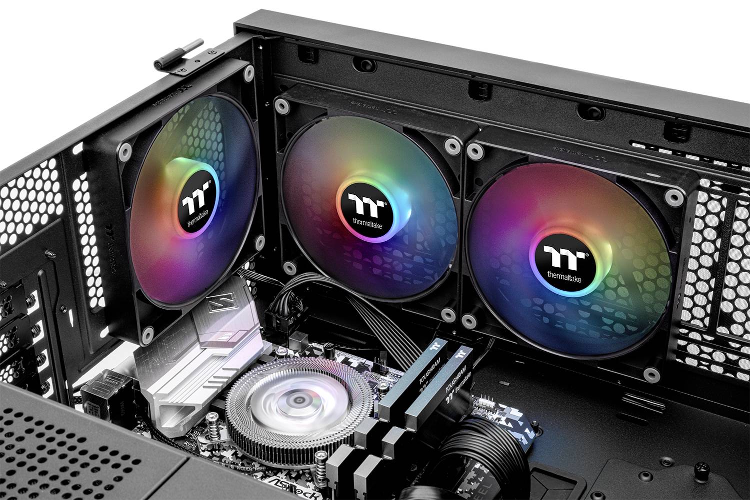 Three colourful, illuminated computer fans inside an open computer case, surrounded by other hardware components.