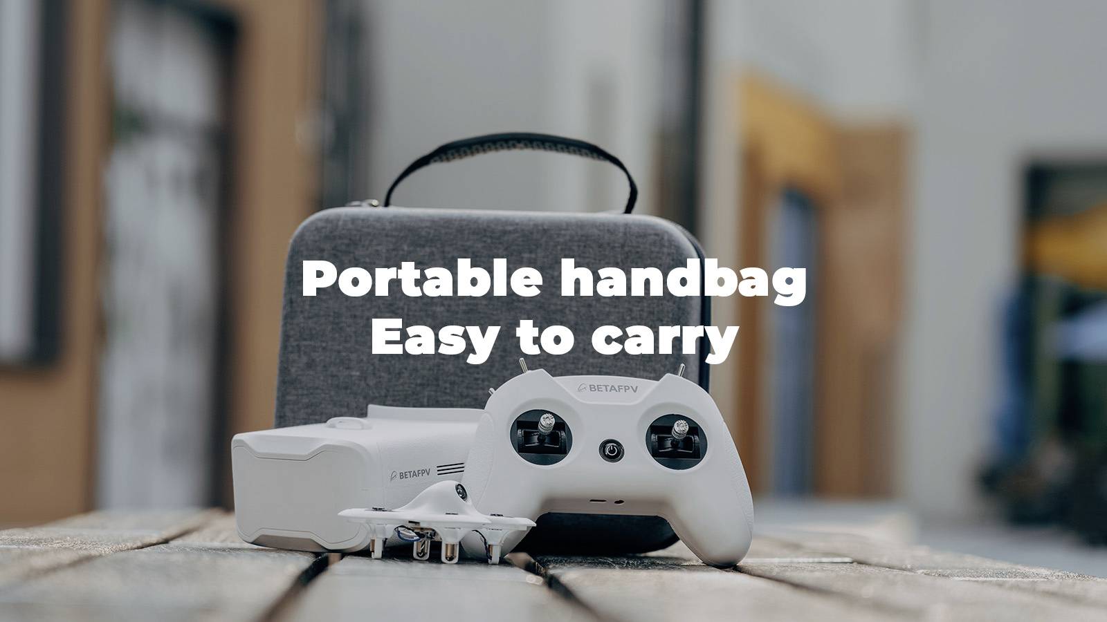 A portable bag, easy to carry, with a drone and remote control on a wooden table.