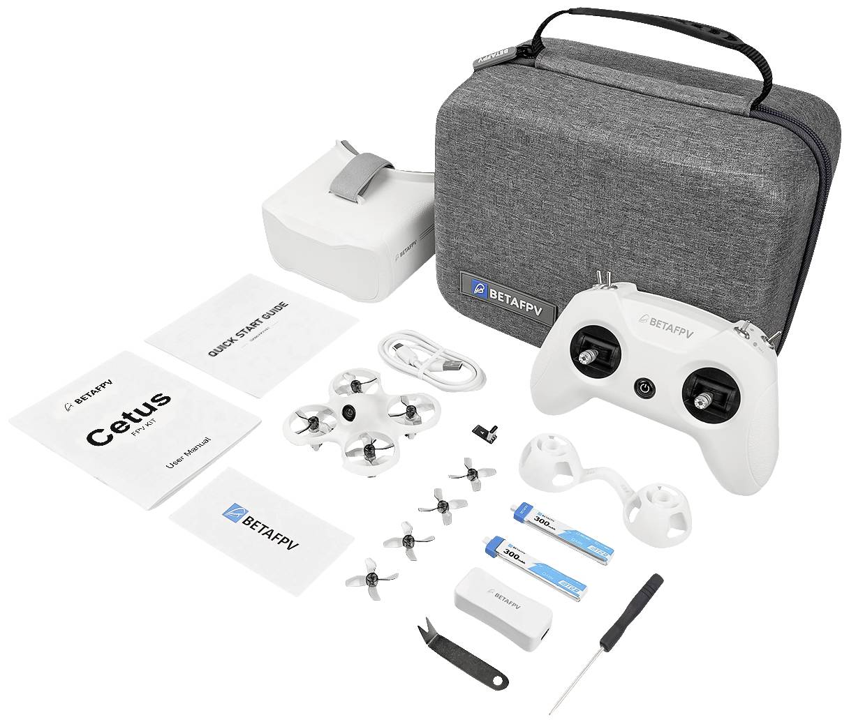 A drone combination with remote control, spare rotors, goggles and carry case. Operating manual and accessories are included.