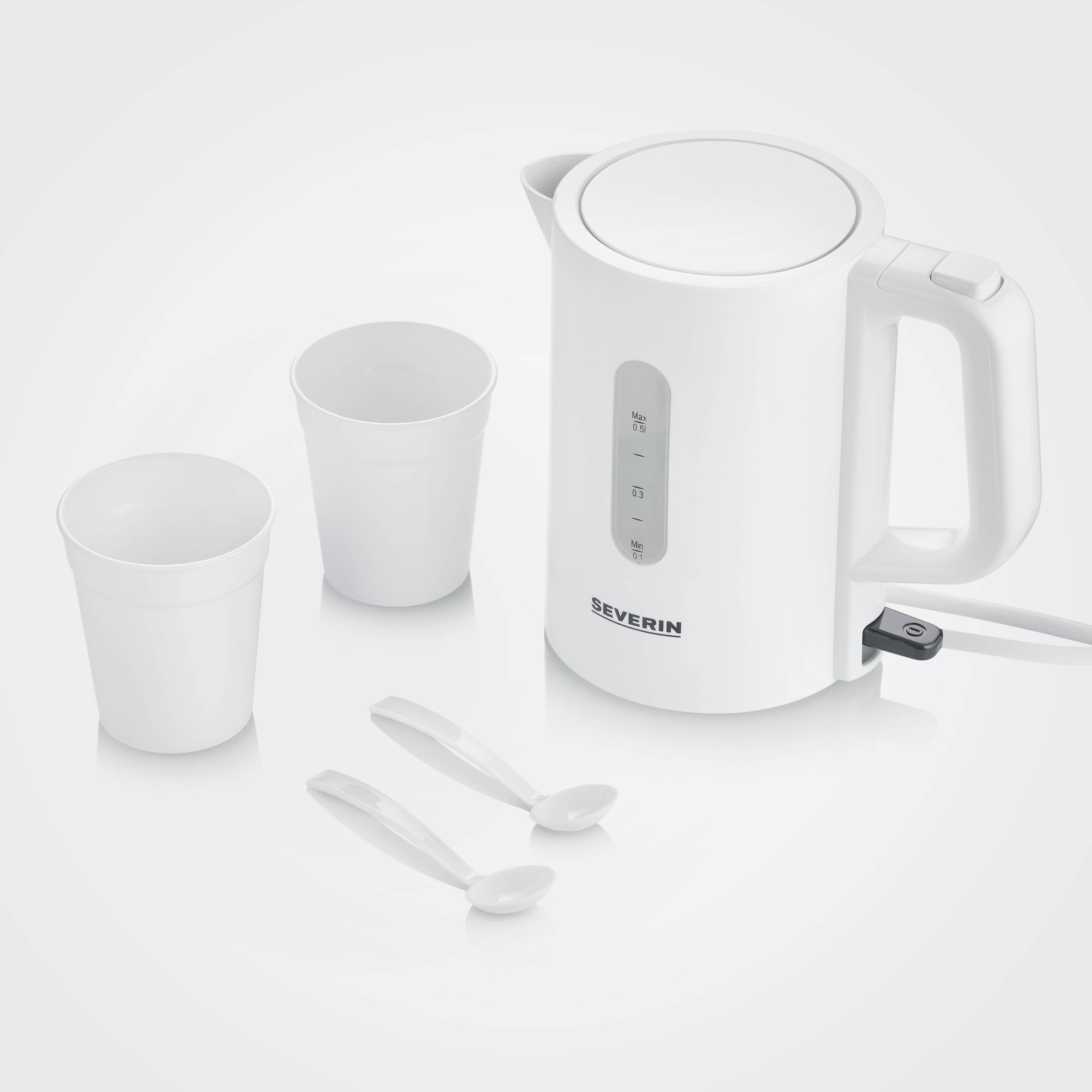 A white kettle next to two white mugs and two small teaspoons on a light surface.