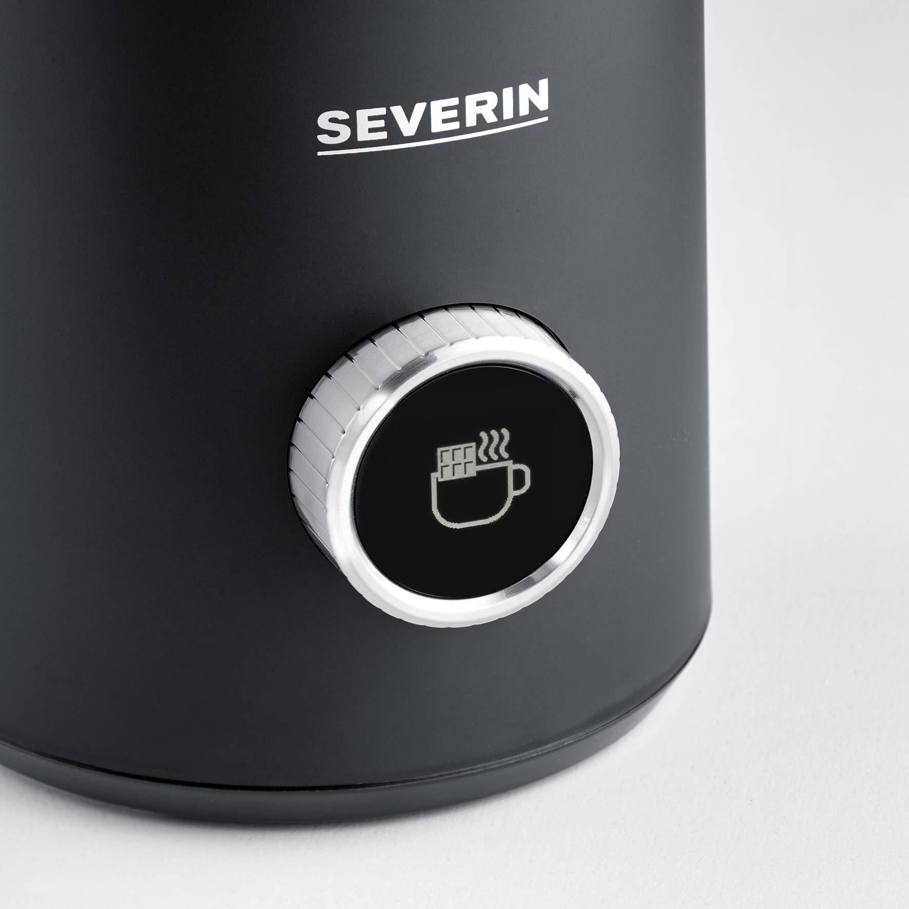 A black electric milk frother by the brand 'Severin'. The device features a symbol depicting steaming milk.