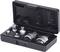 An open black case containing several metal tools, likely adapters or sockets, precisely fitted into recesses.