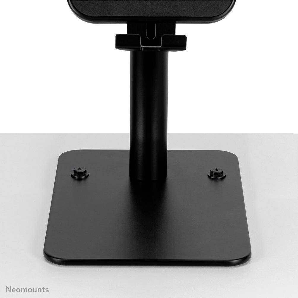 A black monitor stand by Neomounts with a square base and sturdy, vertical column against a light background.