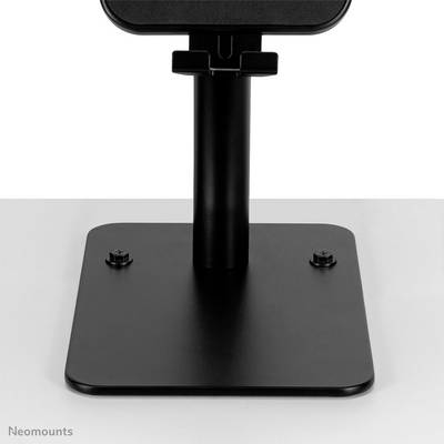 A black monitor stand by Neomounts with a square base and sturdy, vertical column against a light background.