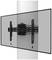 A television wall mount attached to a vertical pipe, showing the mechanical structure supporting a screen.