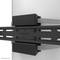 A black wall mount with straps attached to a cylindrical white object, presumably for mounting a display screen.