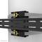 A mounting bracket for attaching a monitor to a round pole. Two tension straps stabilise the construction.