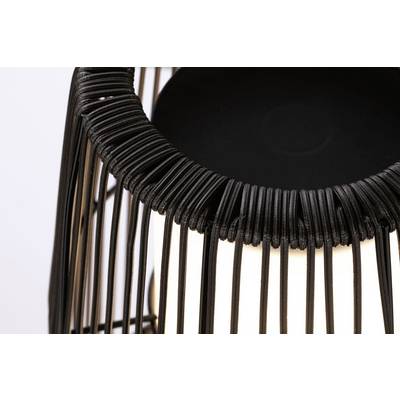 Black, braided lamp fitting with exposed light bulb. Modern design focusing on textile structure and illumination.