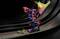 'Coloured robotic arm interacts with digital 3D graphics in a futuristic space; symbolises technological innovations.'