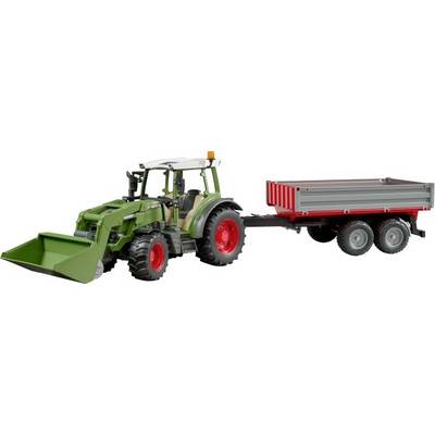 Tractor with front loader, attached two-axle trailer. Green with red wheels. Suitable for agricultural work.