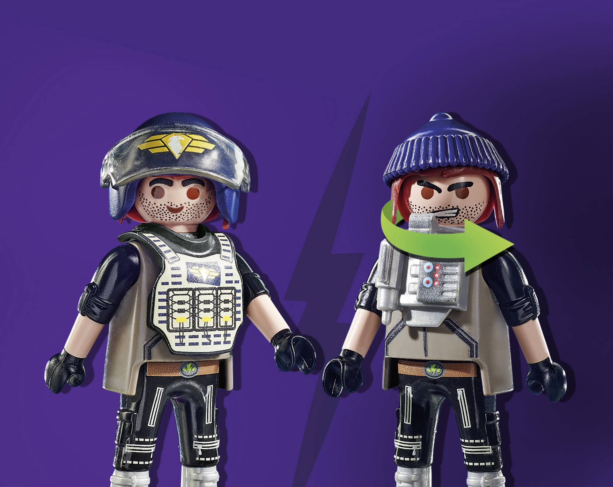 Two game pieces in front of a lilac background. One is wearing a helmet with an emblem, the other a cap and green sash.