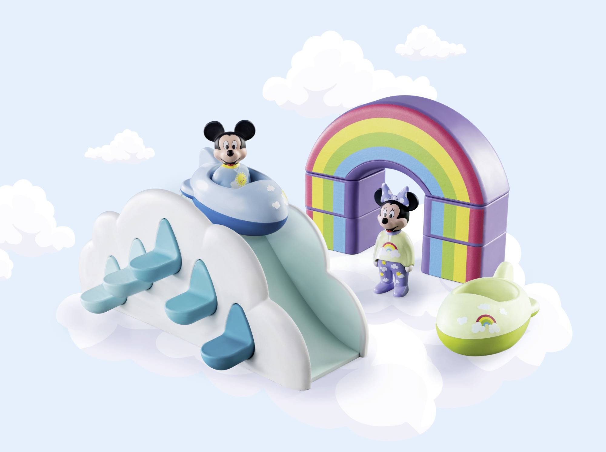 Toy set with figurines on a cloud slide and rainbow arch; one figure flying in a small aeroplane. Playful scene.