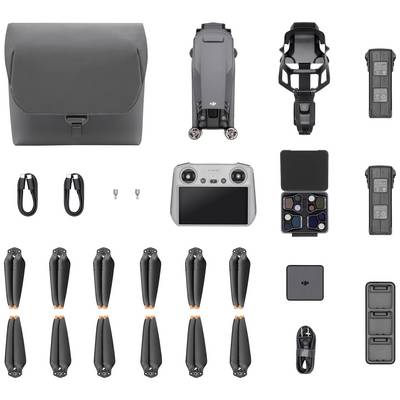 'Various drone accessories include a bag, remote control, spare propellers, filters, cables and batteries, neatly arranged.'