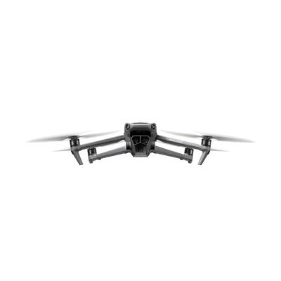 A drone in frontal view, hovering in the air, with four rotors spinning.
