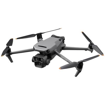 Grey four-rotor drone with camera hovering in the air. It has a compact design with orange accent markings on the rotor blades.
