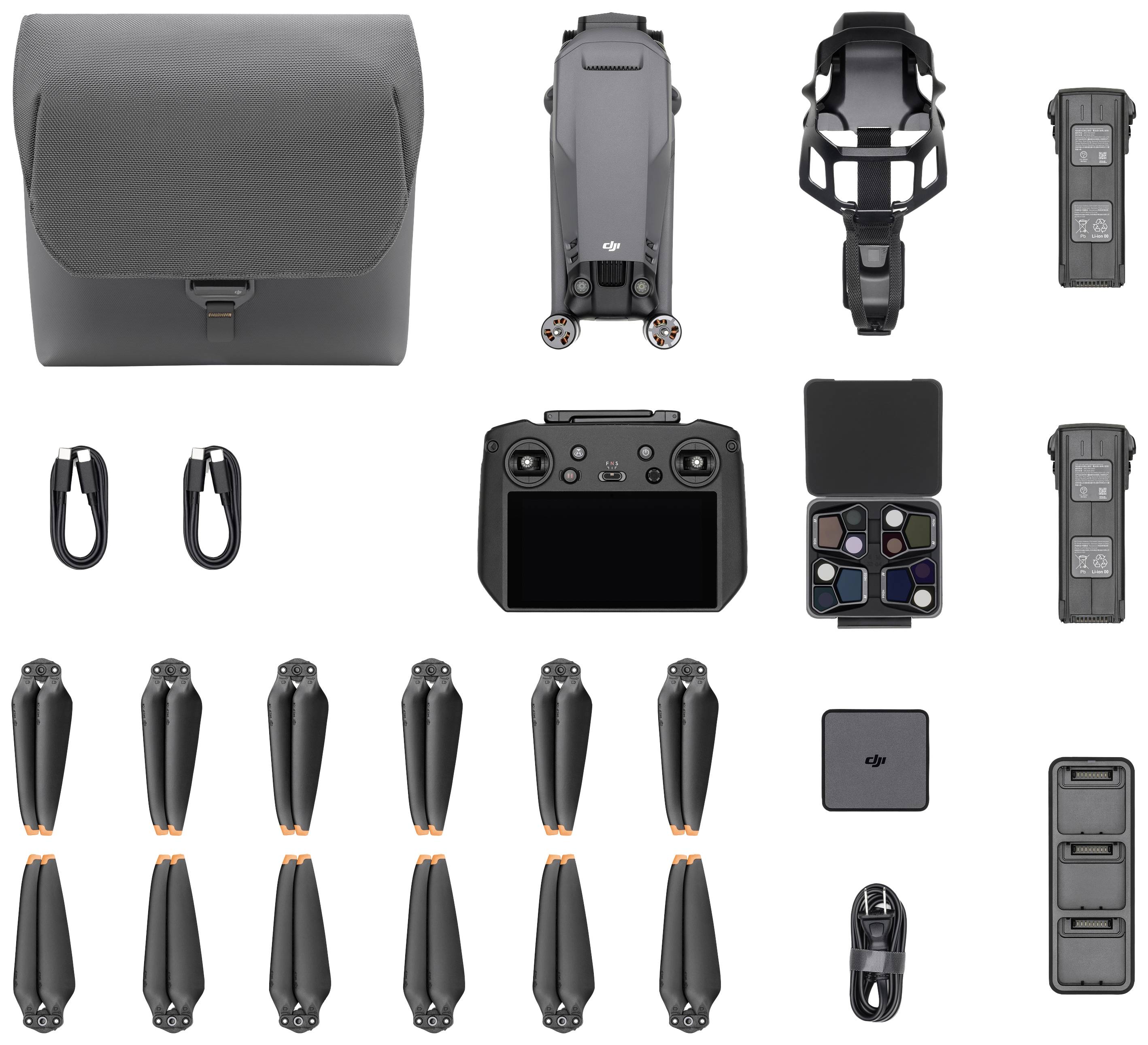 Various drone components and accessories arranged on a white background, including propellers, a remote control, and a carry case.