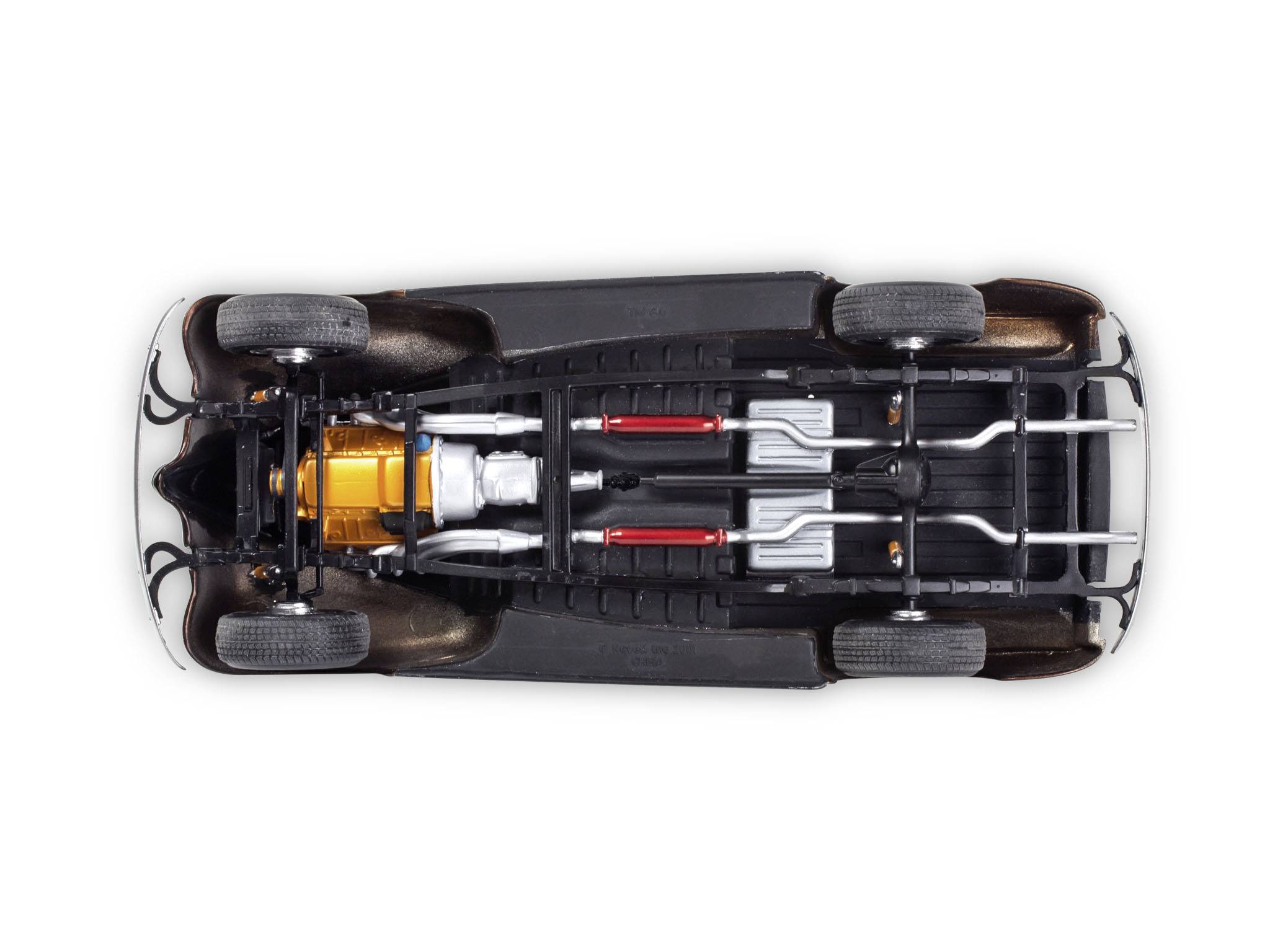 View of a vehicle's undercarriage with visible exhaust system and drivetrain.