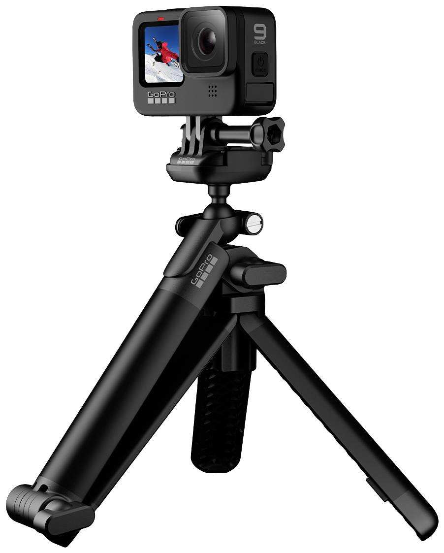 Action camera on a black tripod, with an image of a snowboarding person on the display.